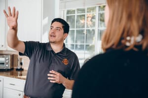 mold removal technician talking to customer