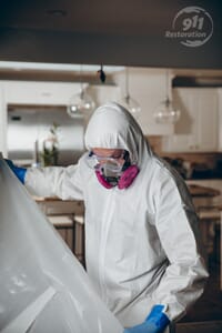 technician sectioning off rooms during mold removal